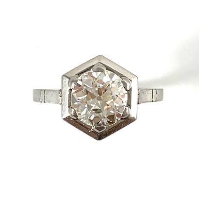null SOLITARY RING holding a 1.62 carat old cut diamond in a hexagonal bezel. Set...