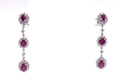null PAIR OF EARRINGS set with three flowers in a ruby pendant surrounded by brilliant-cut...