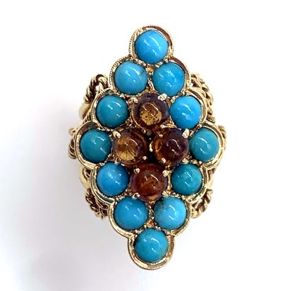 null A diamond-shaped ring holding four citrines in a circle of cabochon turquoise....