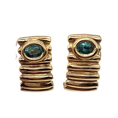 null MELLERIO PAIR OF EARRINGS holding an oval emerald in a linear 18K yellow gold...