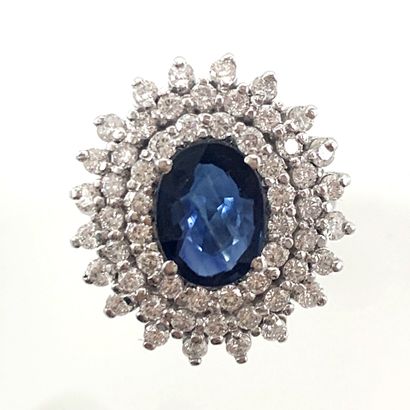 null POMPADOUR RING holding in its center an oval sapphire of about 1.5 carat in...