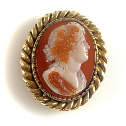 A cameo on agate representing a woman in...
