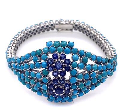 null BRACELET with a floral design paved with sapphires and turquoise cabochon. Mounting...