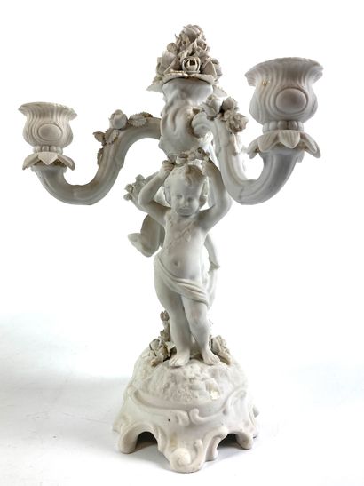 null Pair of candelabra in biscuit with three arms of light decorated with cherubs...