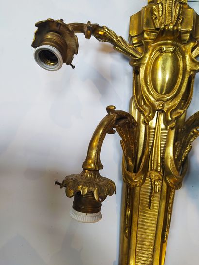 null An important PAIR OF ormolu and chased sconces with five moving light arms on...