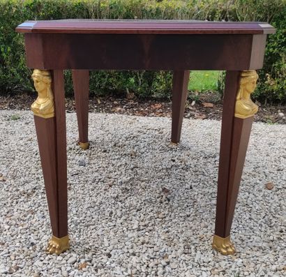 null Mahogany LOW TABLE of rectangular shape and resting on four legs with cariatid...