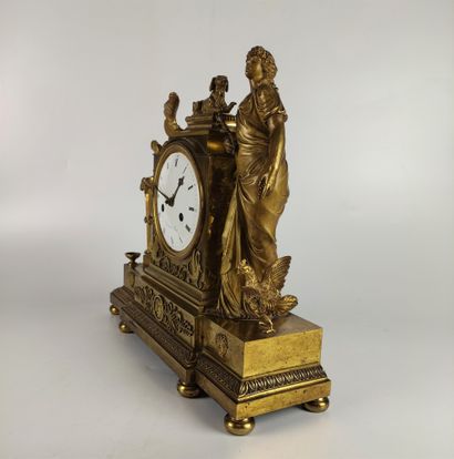 null An ormolu and chased clock decorated with a vestal and her dog leaning on a...