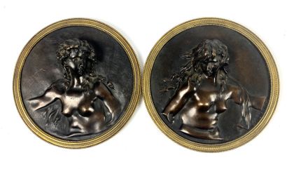 null After CLODION Pair of bronze medallions with brown patina and repoussé decoration...