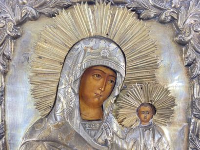  ICONE en métal doré représentant la Vierge à l'Enfant. Coffret sous verre. XIXe...