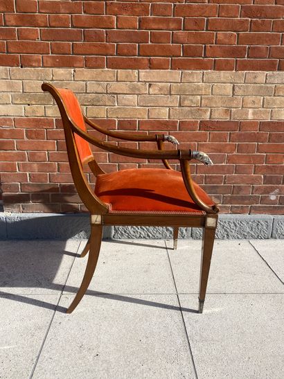 null Mahogany armchair with a slightly overturned backrest, the armrests ending in...