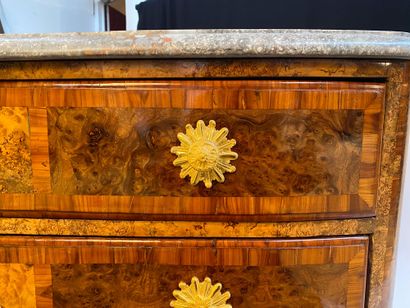 null A veneer and marquetry chest of drawers opening on the front with three drawers...