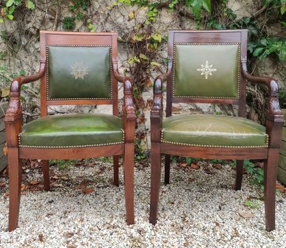 null Pair of mahogany armchairs, the rounded armrests with dolphin neck. They stand...