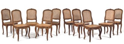  Suite of TEN CANNED CHAIRS in natural wood, moulded and carved with flowers, with...