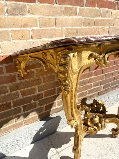 null CONSOLE of movement form in gilded wood moulded and carved with staples, flowers...