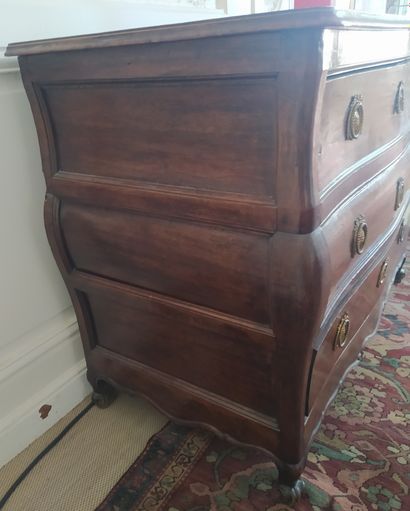 null Walnut chest of drawers opening in front of three drawers, the sides with molded...