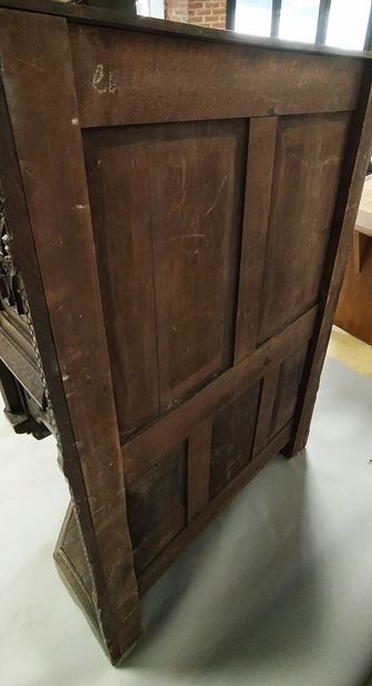 null Carved oak chest of drawers with a trapezoidal plan and arcatures decoration....