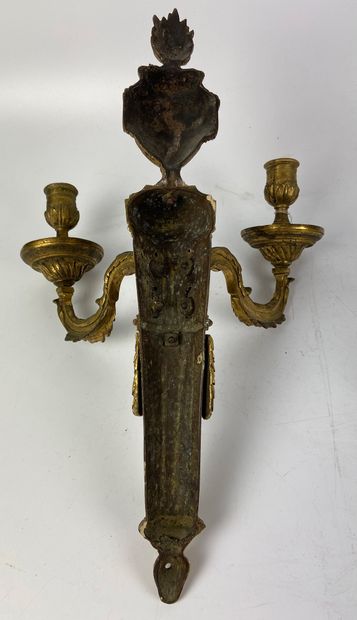 null Pair of gilt bronze and chased sconces with two arms of lights topped by a fire...