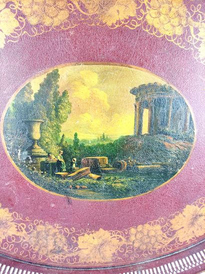 null Oval sheet metal PLATE decorated with an antique ruin in a frame of grapes....