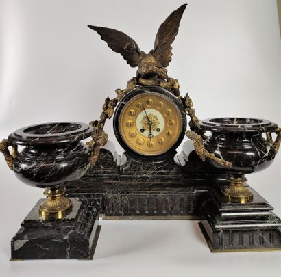 null A green marble fireplace set including a clock decorated with an eagle in gilt...