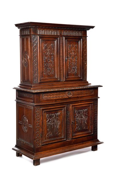 A carved walnut two-body chest of drawers...
