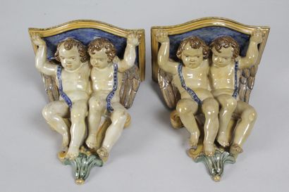 Pair of earthenware console tables with cherubs...
