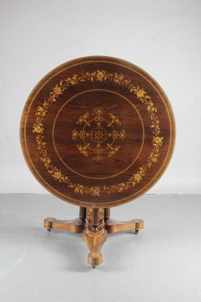 null ROUND GUERIDON, with a tilting top in rosewood and light wood marquetry decorated...