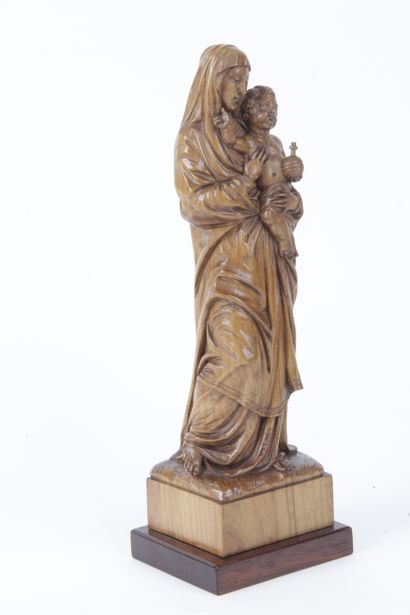 Standing Virgin carrying Christ holding a...