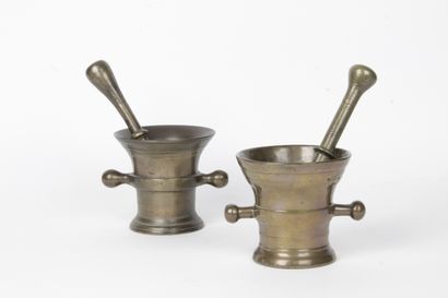 null TWO MUGS AND THEIR PILONS, in bronze of truncated cone shape and double ball...