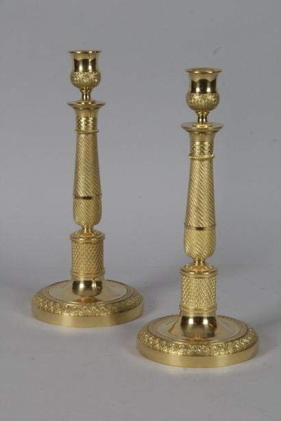null PAIR OF CANDLES, in gilt bronze and chased with tortoiseshell, pearls and flowers....