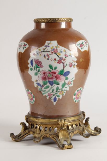null China, 18th century Porcelain and enamel vase of the pink family on a café au...