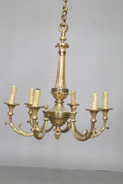 null A Louis XVI style bronze chandelier with six arms decorated with foliage, pine...