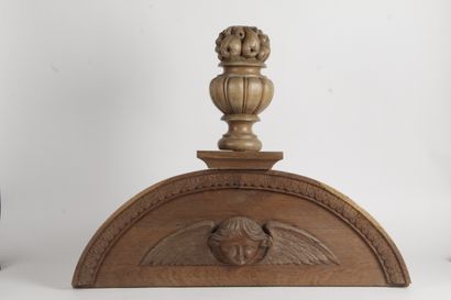 null TWO arched oak door sills carved in the round with winged cherubs topped by...