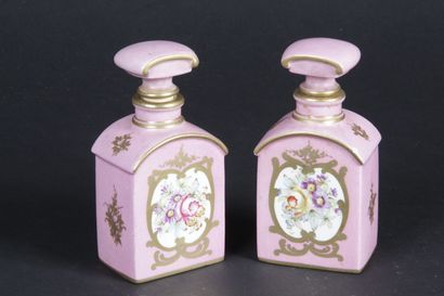 null PORCELAIN OF PARIS. Pair of perfume bottles and their stoppers, in pink porcelain...