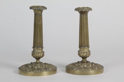 A PAIR OF CANDLES, in copper with fluted...
