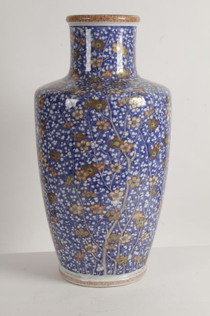 null Japan, circa 1900 A large porcelain baluster vase with a white reserved decoration...