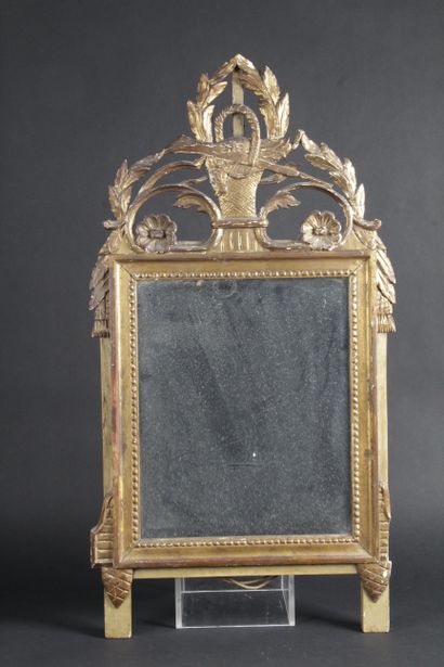 null A Louis XVI style FRONTON MIRROR, in carved and openworked giltwood decorated...