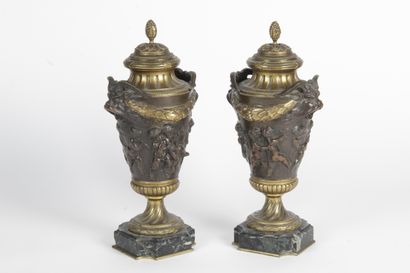 null Pair of bronze urns, with brown patina and gilded Louis XVI style decorated...