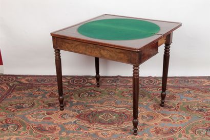 null A Louis-Philippe period mahogany and mahogany veneer game table with a wallet...