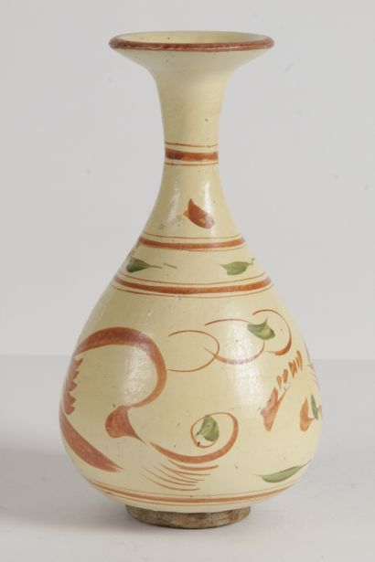 null China A brown stoneware long-necked piriform vase with yellow glaze and stylized...