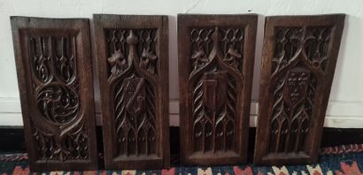 SET OF FOUR LITTLE PANELS in carved oak decorated...