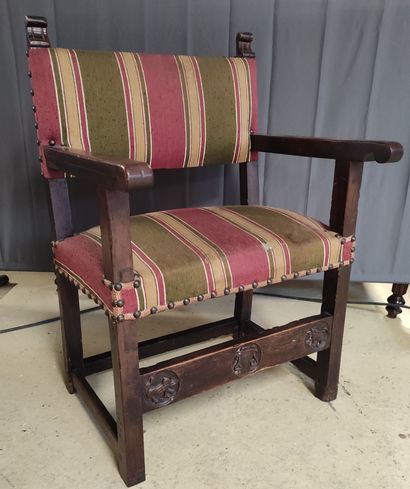 null Walnut armchair with a front band carved with a cardinal's hat and two lions...