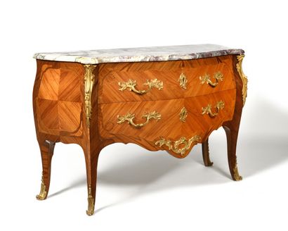 null A veneer and marquetry chest of drawers opening on the front with two drawers...