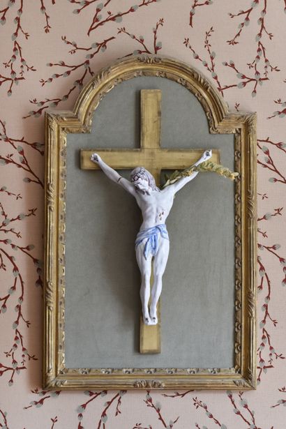 null A white and polychrome Nevers earthenware CHRIST ON A CROSS in a frame with...