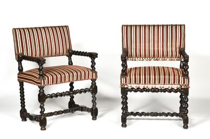 null TWO armchairs that can form a pair in walnut, twisted legs and armrests with...