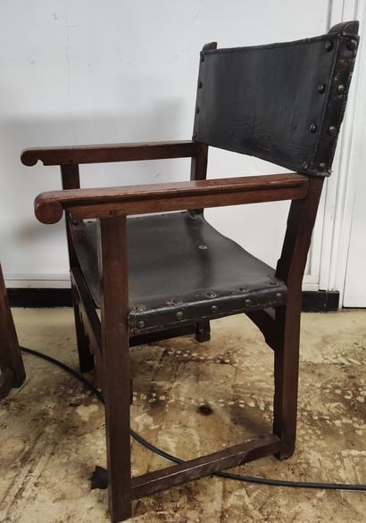 null LOT of three oak armchairs with leather seats and backs, cut-out or openwork...