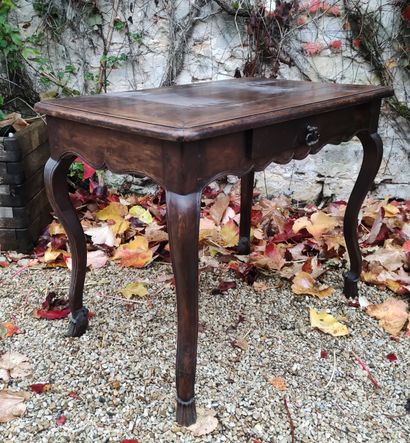 null Walnut writing table opening with a drawer in the waist, the notched belt, it...