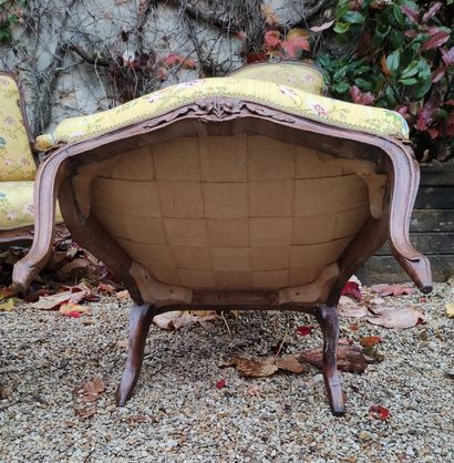 null FOUR ARMCHAIRS, one pair of which are made of natural wood, moulded and carved...
