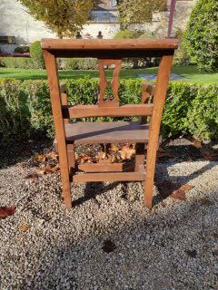 null Walnut and oak armchair, back and front decorated with a stylized lyre. 19th...