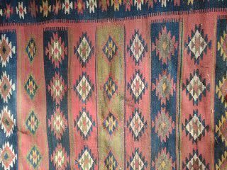 null KILIM with diamond patterns on a red background. Turkey, first half of the 20th...