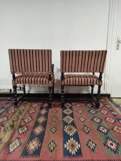 null TWO armchairs that can form a pair in walnut, twisted legs and armrests with...
